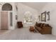 Cozy living room with comfortable seating, a decorative mirror, and lots of natural light at 4531 W Flint St, Chandler, AZ 85226