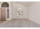 Open living room space featuring large window and neutral decor at 4531 W Flint St, Chandler, AZ 85226