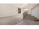 Open-concept living area with staircase, tile entryway, and light neutral decor at 4531 W Flint St, Chandler, AZ 85226