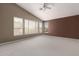Spacious main bedroom featuring high ceilings and large windows, creating a bright and airy retreat at 4531 W Flint St, Chandler, AZ 85226