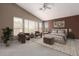 A spacious bedroom with a sitting area, plush bed, and ample natural light at 4531 W Flint St, Chandler, AZ 85226
