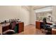 Functional home office with hardwood floors, dual desks, and ample workspace at 4531 W Flint St, Chandler, AZ 85226