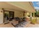 Cozy covered patio with comfortable seating, perfect for enjoying outdoor living and entertaining guests at 4558 E Vista Dr, Phoenix, AZ 85032