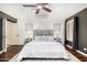 Comfortable bedroom featuring wood floors, overhead fan, and neutral decor at 4558 E Vista Dr, Phoenix, AZ 85032