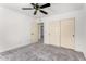 Bedroom featuring a ceiling fan, closet, and open doorway at 4558 E Vista Dr, Phoenix, AZ 85032