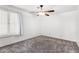 Bedroom with plantation shutters and modern ceiling fan at 4558 E Vista Dr, Phoenix, AZ 85032