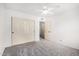 Bedroom boasts a ceiling fan, closet, and adjacent doorway at 4558 E Vista Dr, Phoenix, AZ 85032