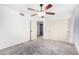 Bedroom featuring a ceiling fan, closet, and open doorway at 4558 E Vista Dr, Phoenix, AZ 85032
