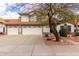 Charming two-story home featuring a three car garage, a tile roof, and well-maintained landscaping at 4558 E Vista Dr, Phoenix, AZ 85032