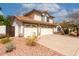 Charming two-story home featuring a three car garage, a tile roof, and desert landscaping at 4558 E Vista Dr, Phoenix, AZ 85032