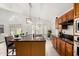 Bright, well-lit kitchen with island, stainless appliances, and modern lighting at 4558 E Vista Dr, Phoenix, AZ 85032