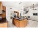 Open-concept kitchen with island seating, stainless steel appliances, and easy access to living areas at 4558 E Vista Dr, Phoenix, AZ 85032