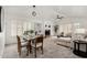 Bright living room with fireplace, dining table, and neutral tones, perfect for gatherings at 4558 E Vista Dr, Phoenix, AZ 85032