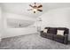 Bright living room featuring neutral color scheme and vaulted ceilings with a contemporary ceiling fan at 4558 E Vista Dr, Phoenix, AZ 85032