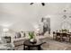 Comfortable living area with views of stairs and dining room providing a spacious, inviting feel at 4558 E Vista Dr, Phoenix, AZ 85032
