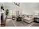 Bright living room with fireplace, plantation shutters, and neutral decor providing a cozy atmosphere at 4558 E Vista Dr, Phoenix, AZ 85032