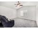 Living room showcasing a ceiling fan, plantation shutters, and comfortable seating at 4558 E Vista Dr, Phoenix, AZ 85032
