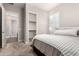 Relaxing bedroom featuring an open walk-in closet and an ensuite bathroom for convenience and privacy at 4884 S Hemet St, Gilbert, AZ 85298