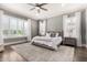 Serene bedroom with natural light, a comfortable bed, and neutral decor at 4884 S Hemet St, Gilbert, AZ 85298