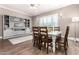 Dining room featuring a white table with wooden chairs and a decorative cabinet at 4884 S Hemet St, Gilbert, AZ 85298