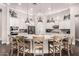Bright kitchen featuring an island with seating, stainless steel appliances, and pendant lighting at 4884 S Hemet St, Gilbert, AZ 85298