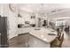 Modern kitchen with white cabinets, stone countertops, and an open layout, perfect for cooking and socializing at 4884 S Hemet St, Gilbert, AZ 85298
