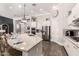 An expansive kitchen offers a large island, stainless appliances and dark hardwood flooring at 4884 S Hemet St, Gilbert, AZ 85298