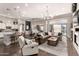 Open-concept living room and kitchen with hardwood floors and an inviting atmosphere, perfect for entertaining at 4884 S Hemet St, Gilbert, AZ 85298