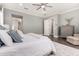 Serene main bedroom with hardwood floors, a ceiling fan, a dresser, and a chaise lounge at 4884 S Hemet St, Gilbert, AZ 85298