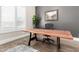 Contemporary office space featuring a wooden desk, comfortable chair, and ample natural light at 4884 S Hemet St, Gilbert, AZ 85298