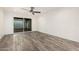 Spacious bedroom featuring wood-look flooring and sliding glass doors at 5142 E Holly St, Phoenix, AZ 85008