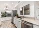 Modern kitchen featuring stainless steel appliances, granite countertops, and white cabinetry at 5142 E Holly St, Phoenix, AZ 85008