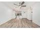 Bright living room with wood-look floors flowing into the kitchen and entryway at 5142 E Holly St, Phoenix, AZ 85008