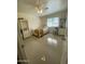 Cozy bedroom with a bed, window, tile floors, and closet space, providing a comfortable retreat at 6107 N 126Th Ave, Litchfield Park, AZ 85340