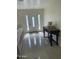 Inviting entryway with gleaming tile floors, decorative table with roses, and decorative glass front door at 6107 N 126Th Ave, Litchfield Park, AZ 85340