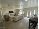 Spacious living room featuring tile floors and a light color scheme, perfect for comfort and relaxation at 6107 N 126Th Ave, Litchfield Park, AZ 85340