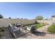 Serene backyard with brick pavers, seating, and a green lawn, ideal for outdoor relaxation and entertainment at 6418 N 17Th St, Phoenix, AZ 85016