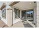 Covered patio with a smooth concrete floor and sliding glass doors leading into the modern interior at 6418 N 17Th St, Phoenix, AZ 85016