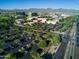 Expansive aerial view showcasing the city, mountains, greenery, and parking spaces at 6438 E Montreal Pl, Scottsdale, AZ 85254