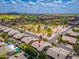Lovely aerial view of community featuring landscaped streets, nearby park, and well-maintained homes with beautiful backyard pools at 6438 E Montreal Pl, Scottsdale, AZ 85254