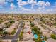 Expansive aerial view of a well-planned community with charming homes, lush greenery, and convenient access to amenities at 6438 E Montreal Pl, Scottsdale, AZ 85254