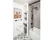 New bathroom with modern fixtures, gray shower tiling, and basket at 6438 E Montreal Pl, Scottsdale, AZ 85254