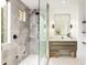 Modern bathroom with a gray tiled walk-in shower, sleek vanity, and stylish fixtures for a spa-like experience at 6438 E Montreal Pl, Scottsdale, AZ 85254