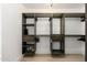 A neutral-toned walk-in closet with open shelving, drawers, and hanging storage solutions at 6438 E Montreal Pl, Scottsdale, AZ 85254
