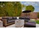 Cozy backyard fire pit surrounded by a comfortable lounge seating area at 6438 E Montreal Pl, Scottsdale, AZ 85254