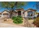 Inviting front exterior of home featuring a desert landscape and covered entryway at 6438 E Montreal Pl, Scottsdale, AZ 85254