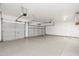Spacious three-car garage with clean epoxy floors, offering ample storage and parking at 6438 E Montreal Pl, Scottsdale, AZ 85254