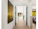 Open hallway featuring contemporary artwork and clear view of backyard pool bringing the outdoor in creating natural light at 6438 E Montreal Pl, Scottsdale, AZ 85254