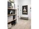 Hallway featuring decor, bench, artistic wall decor, and light wood floors at 6438 E Montreal Pl, Scottsdale, AZ 85254