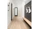 Inviting hallway with a built-in bench and hooks, perfect for organizing coats and accessories near the home's entrance at 6438 E Montreal Pl, Scottsdale, AZ 85254